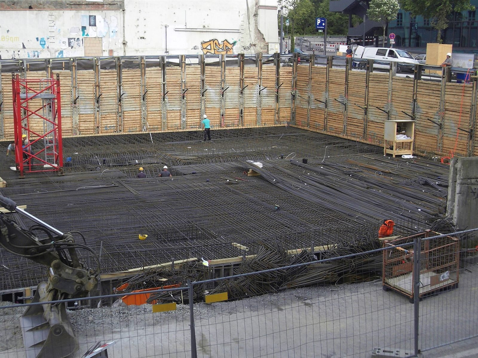 Reinforcement steel laid out at a construction site foundation, ready for concrete pour